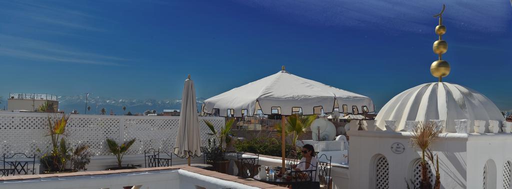 Riad Palais Des Princesses & Spa Marrakesh Esterno foto A terrace in Morocco